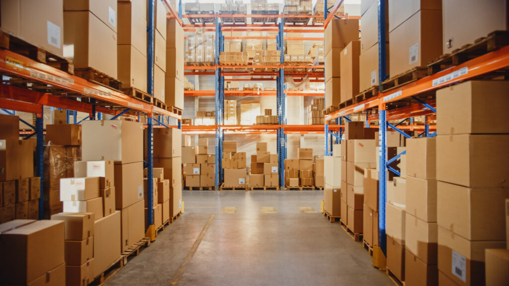 Retail,Warehouse,Full,Of,Shelves,With,Goods,In,Cardboard,Boxes